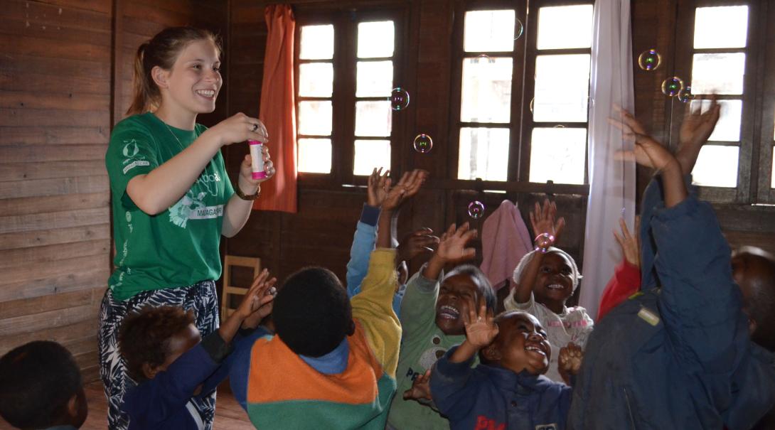 Fundraising is one way of financing your trip to Madagascar. A volunteer is having fun with children in Madagascar after she fundraised her trip to this African country.